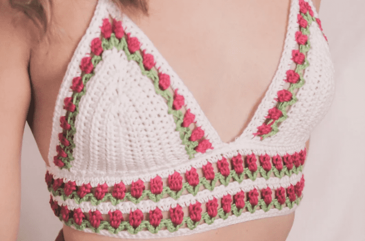 White bralette with tulip embellishments along the bottom and cups.