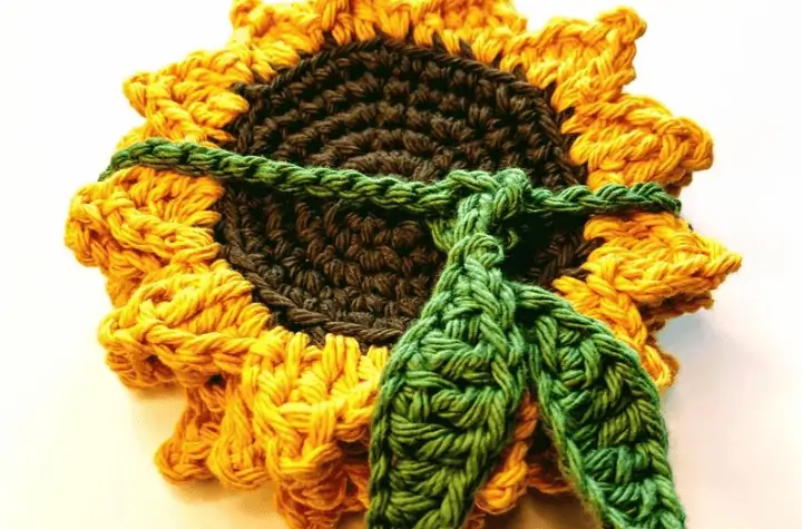 stack of sunflower coasters with leaf string tied around