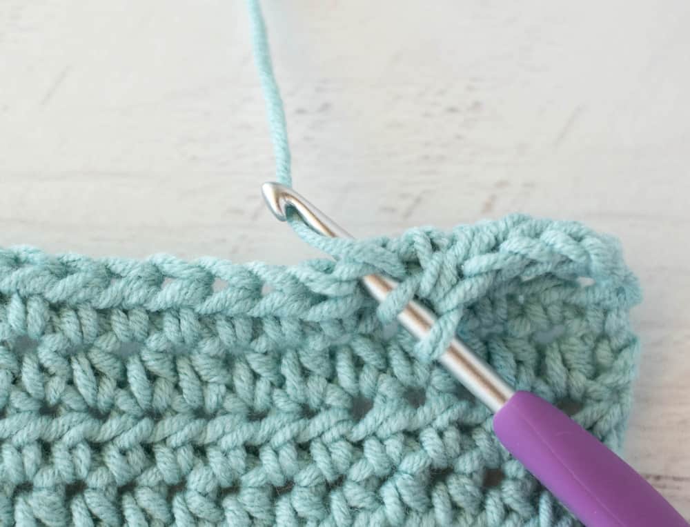blue crochet half double crochet sample with silver and purple crochet hook