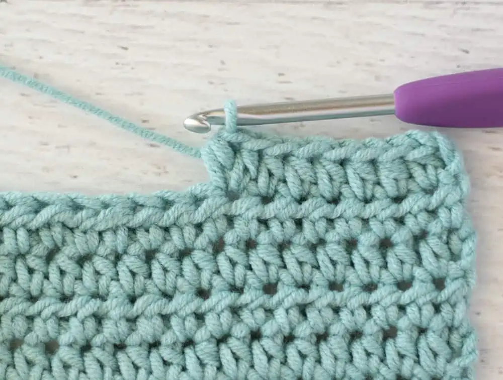 blue crochet half double crochet sample with silver and purple crochet hook