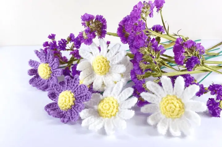 Purple and white crochet daisys