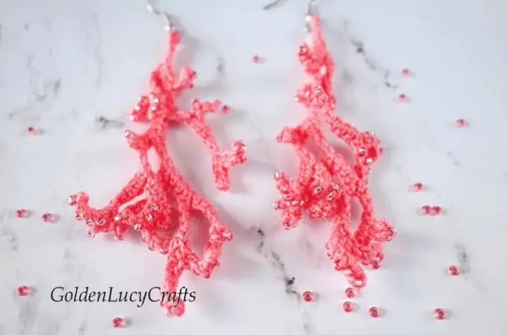 Crochet earrings that look like pieces of coral.