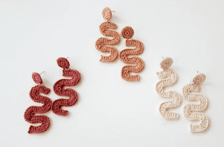 Squiggly crochet earrings in a variety of colors.