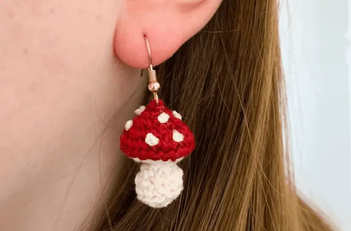 Crochet Earring that looks like a small toadstool mushroom.