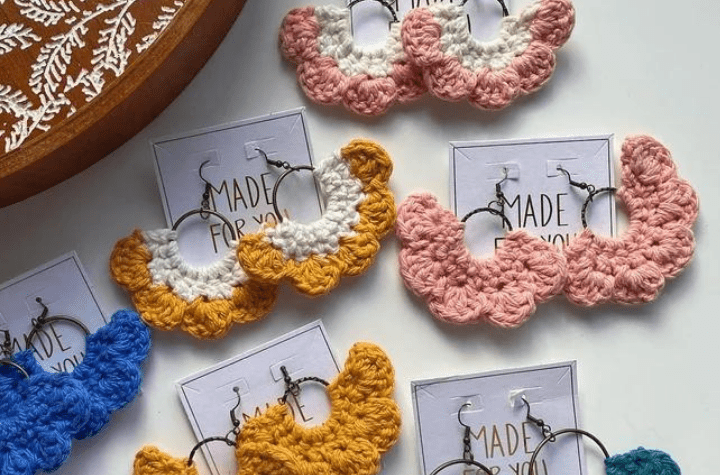 Crochet earrings that look like little puffy clouds.