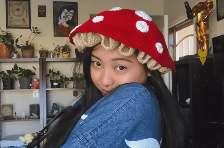 Red crochet mustroom hat with white spots.