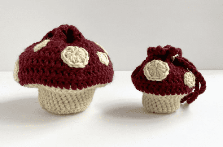 Large and small crochet dice bag shaped like a toadstool mushroom