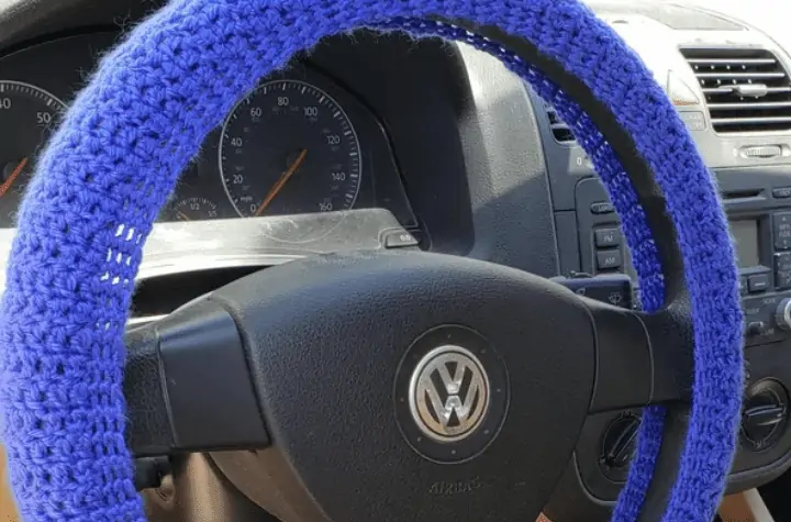 Solid, beginner friendly crochet steering wheel cover.