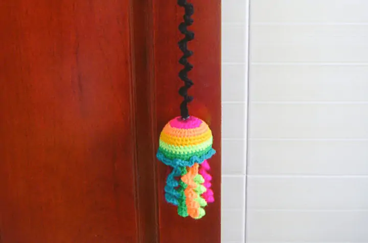 Rainbow jellyfish crochet cat toy.