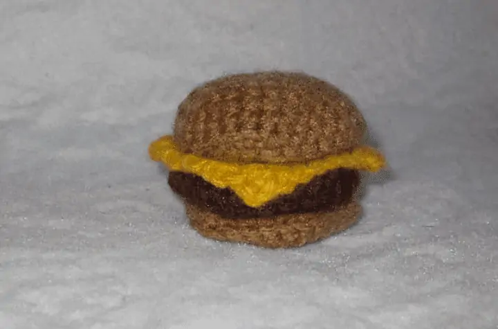 Crochet cheeseburger toy for cats.