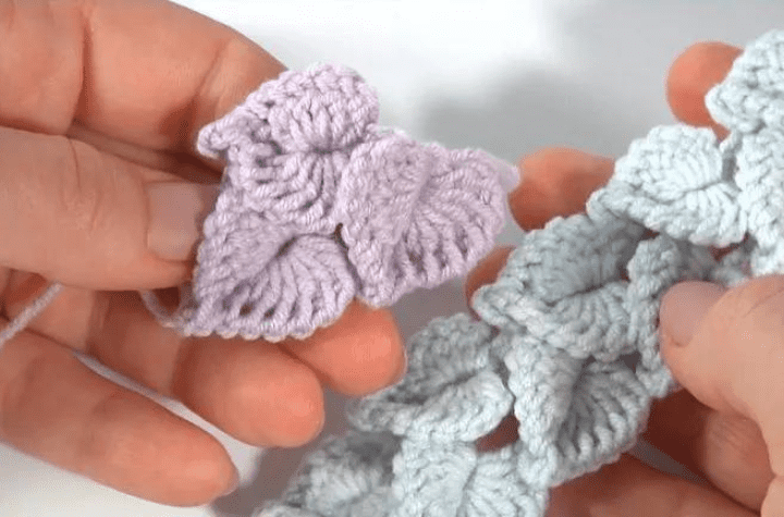 Branch of crochet leaves in pastels.