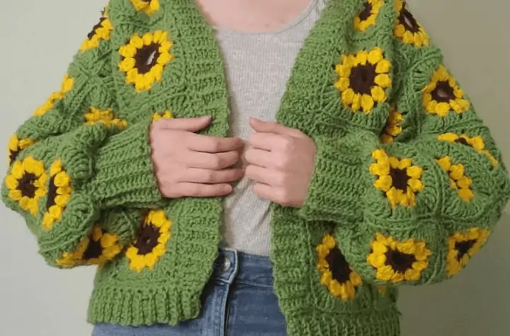 Green cropped cardigan featuring sunflower granny squares.