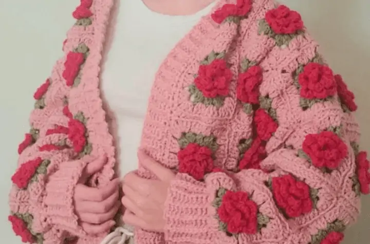 Cropped granny square cardigan featuring granny square roses.