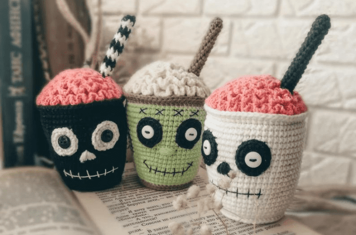 Three amigurumi cups with crochet brains.