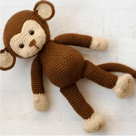 Brown and cream crochet monkey