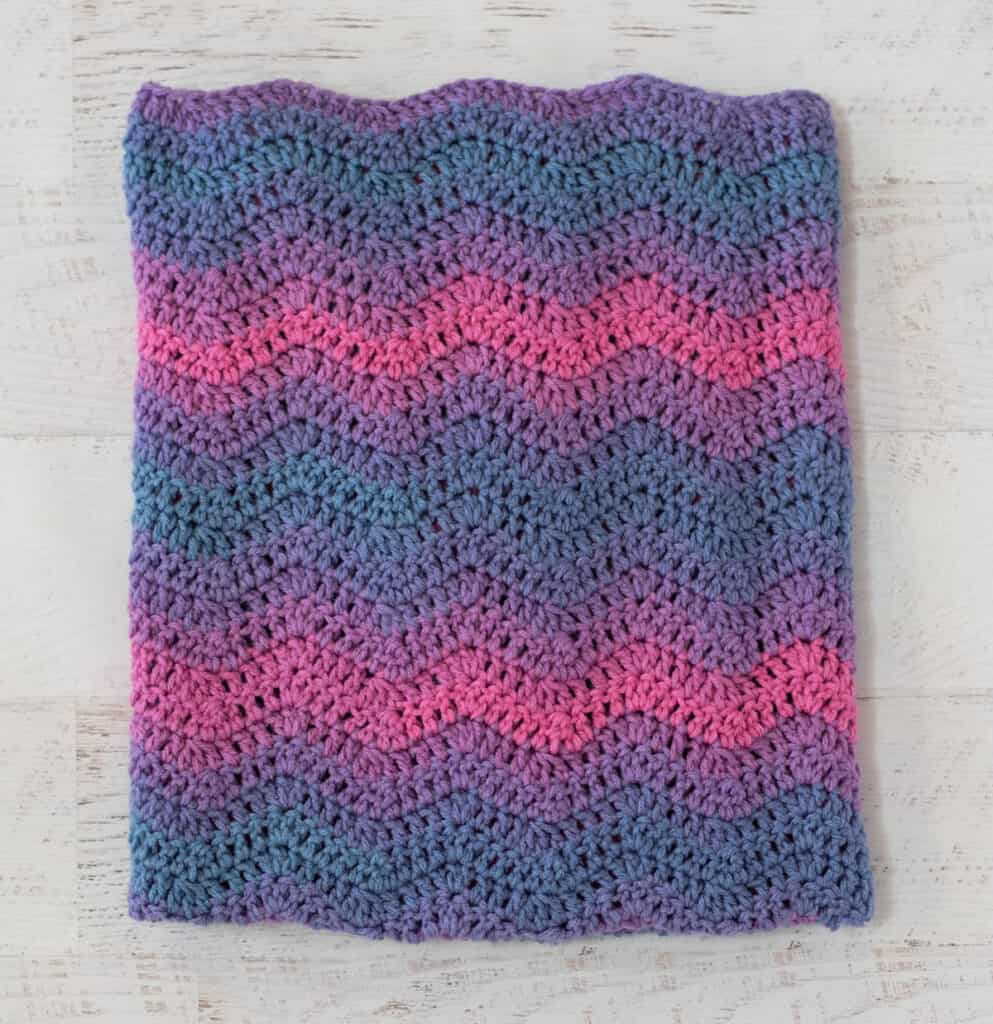 purple, pink and blue ripple stitch baby afghan folded