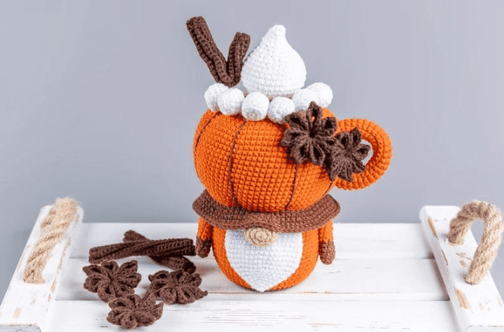 gnome wearing a pumpkin spice hat.