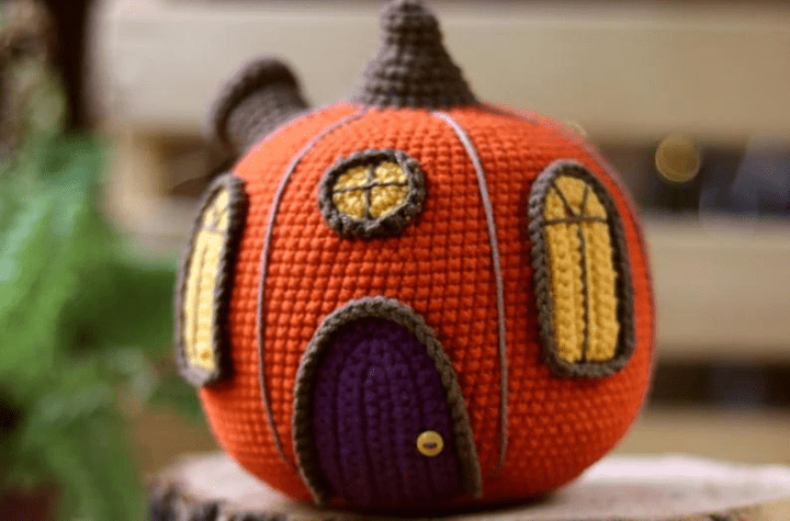 pumpkin amigurumi that looks like a house.