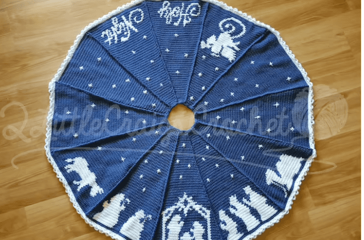 Blue crochet tree skirt featuring a nativity scene.