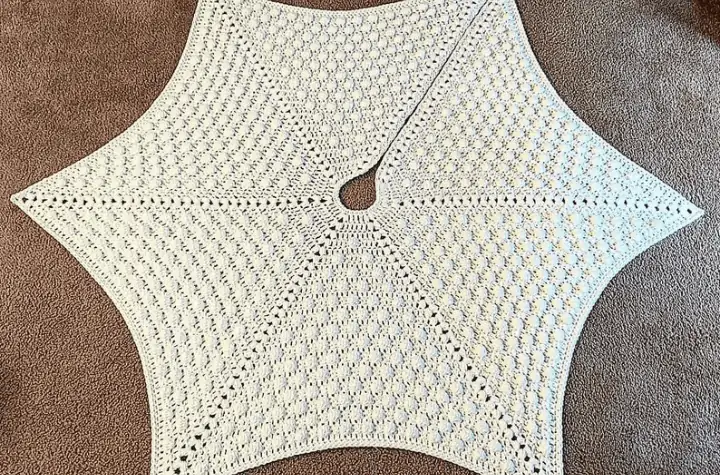 a six pointed star, all-white tree skirt.