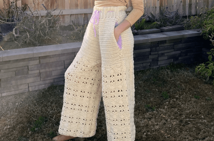 Wide-legged crochet pants with a drawstring closure.