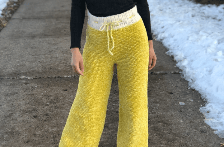 Yellow crochet pants with a white waist band.