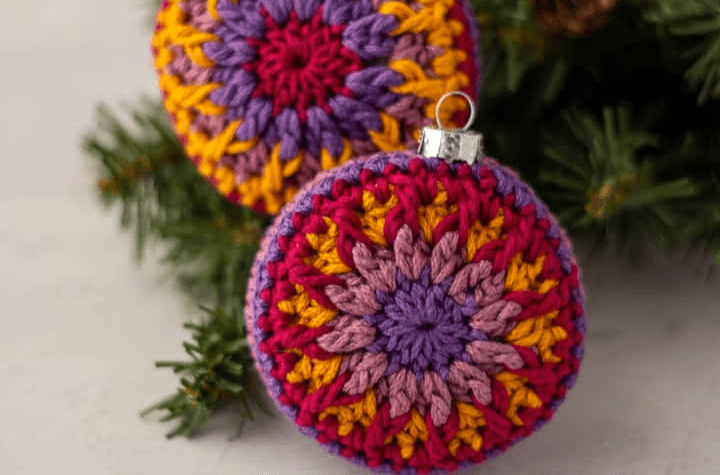 circular crochet ornaments with a flower design.