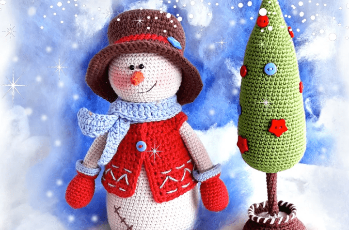 Amigurumi snowman with a crochet tree.