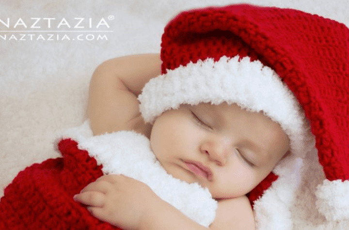 Baby with a crochet Santa hat.