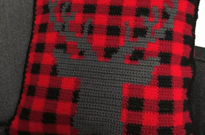 Pillow with a reindeer on it.