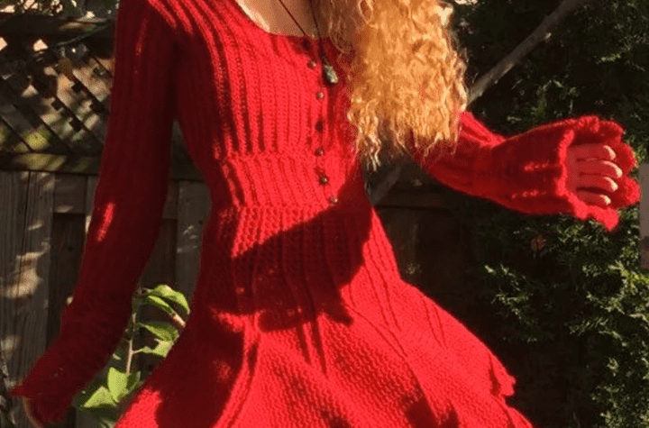 Red crochet dress pattern with long sleeves that flair out at the end.