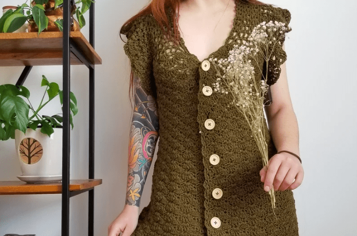 Green crochet dress with buttons going down the entire center of the dress.