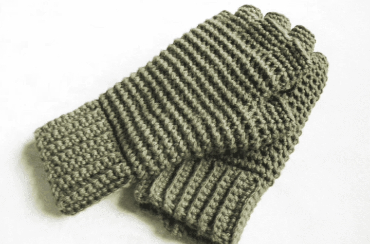 Green finderless gloves with holes for each individual finger.