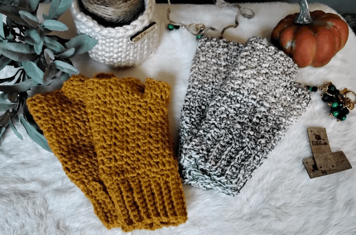 Two pairs of crochet fingerless gloves, one thats yellow and one that is black and white.