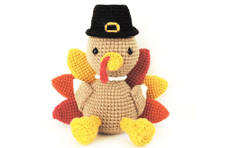 Amigurumi crochet turkey with a pilgrim hat.