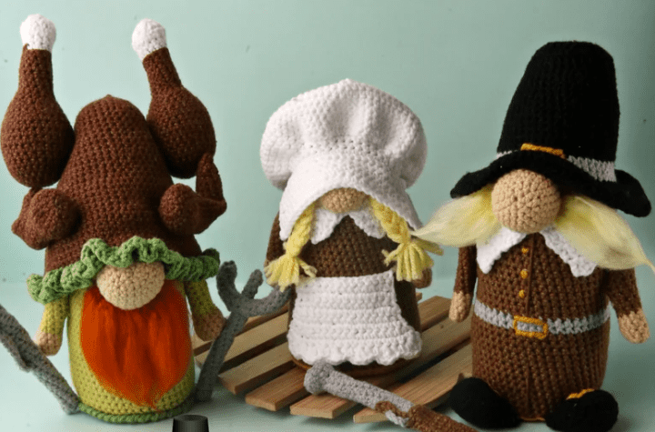 Amigurumi pilgrims and a gnome with a turkey hat.