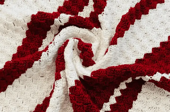 Red and white line crochet afghan.