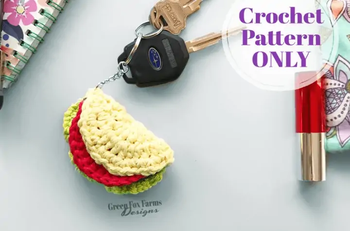 Crochet taco keychain attached to suburu care keys.