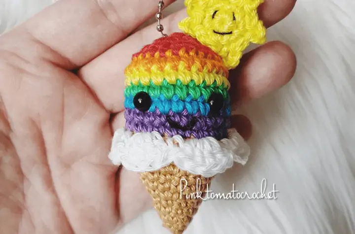 Rainbow crochet ice cream cone with a crochet sun.
