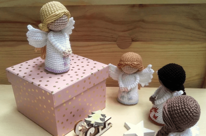 Four crochet angels with different hair colors.