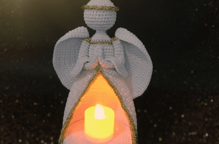 A crochet angel that opens in the middle so that there's room for a tea light candel inside.