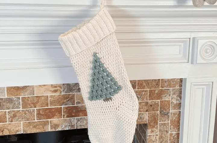 White stocking with a green Christmas tree in the middle