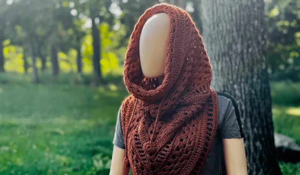 Crochet cowl with orange/brown yarn.