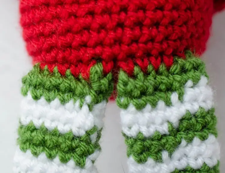 Close up of crochet elf assembly