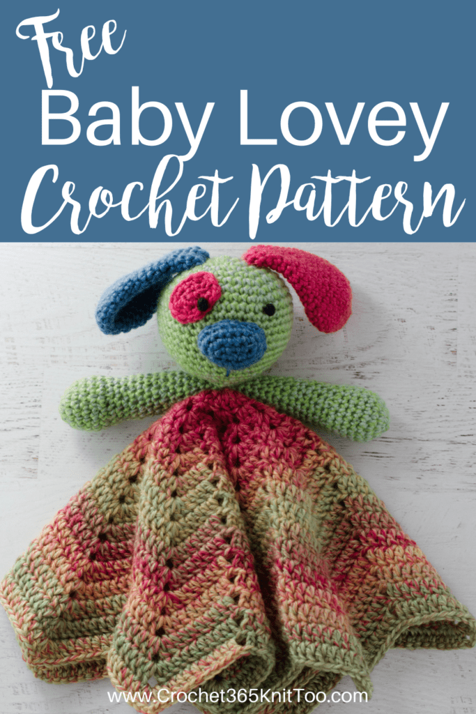 Image of puppy crochet baby lovey in green, pink and blue