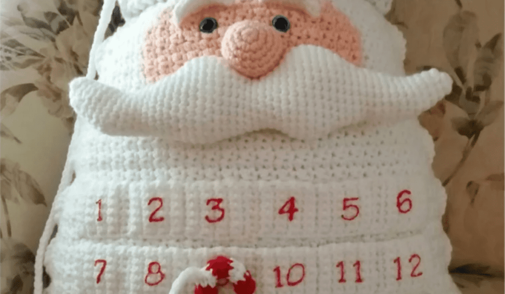 A Santa pillow with pockets to downtown till Christmas and a crocheted candy cane attached by string.
