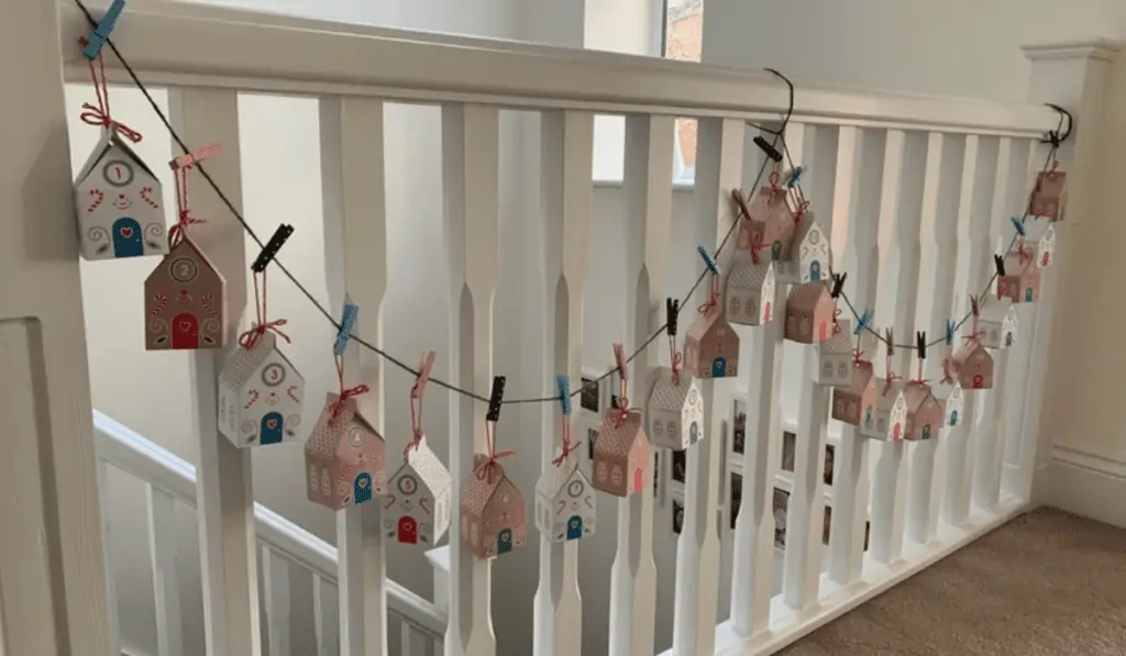 24 cardboard boxes strung along a banister.