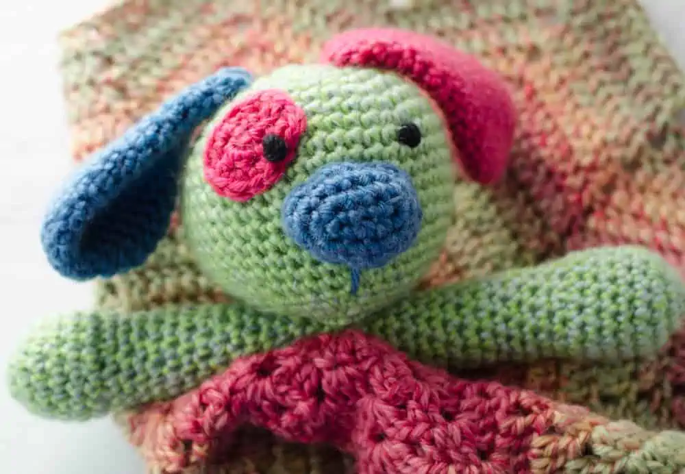 Crochet baby lovey puppy in green, pink and blue