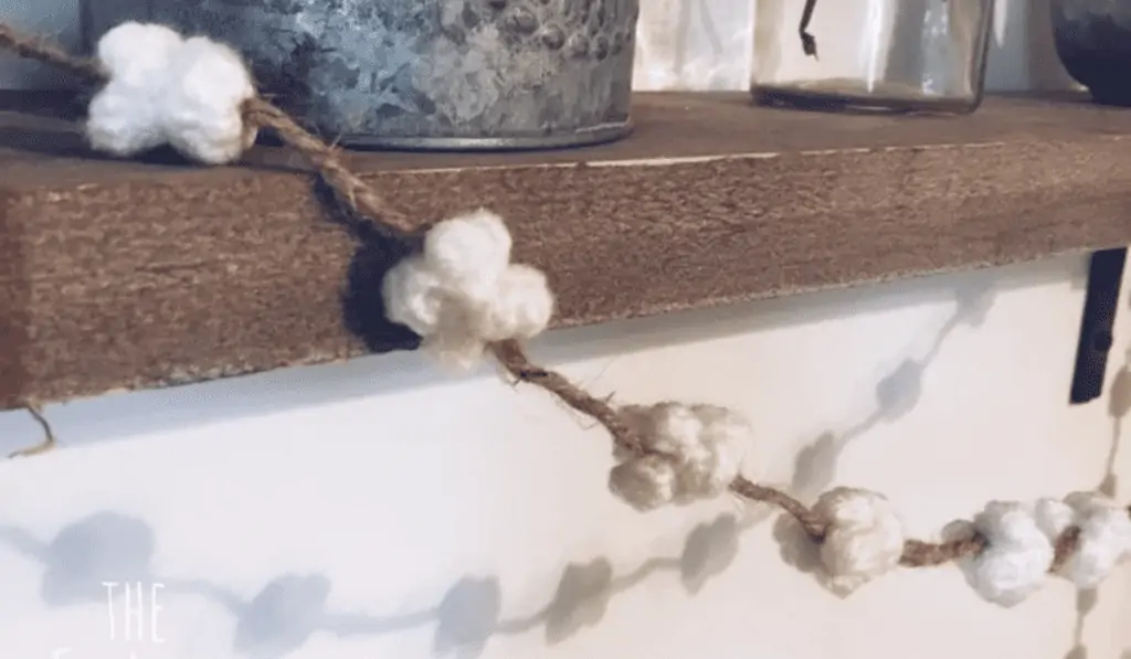 Crochet popcorn garland on a mantle.