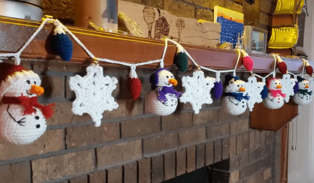 Garland of snowmen, christmas lights, and snowflakes.